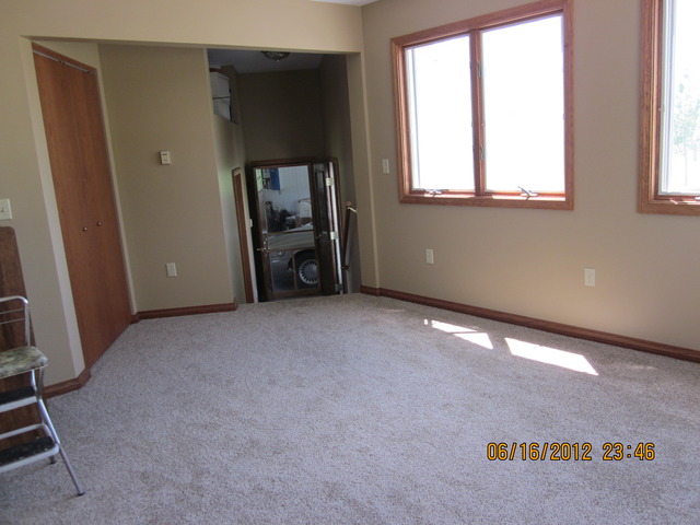 18444 University Road Malta, IL 60150 - Photo 17 of 25 an empty room with windows