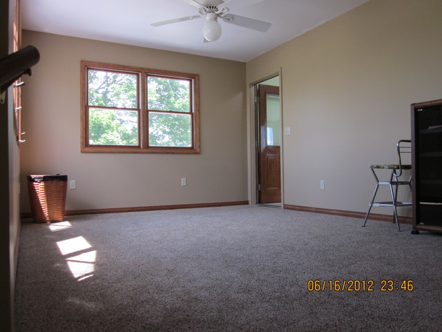 18444 University Road Malta, IL 60150 - Photo 18 of 25 an empty room with windows and ceiling fan