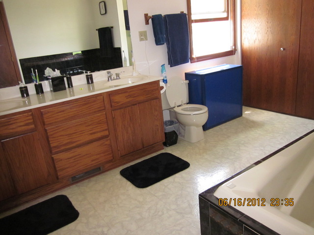 18444 University Road Malta, IL 60150 - Photo 7 of 25 a bathroom with a sink toilet and mirror
