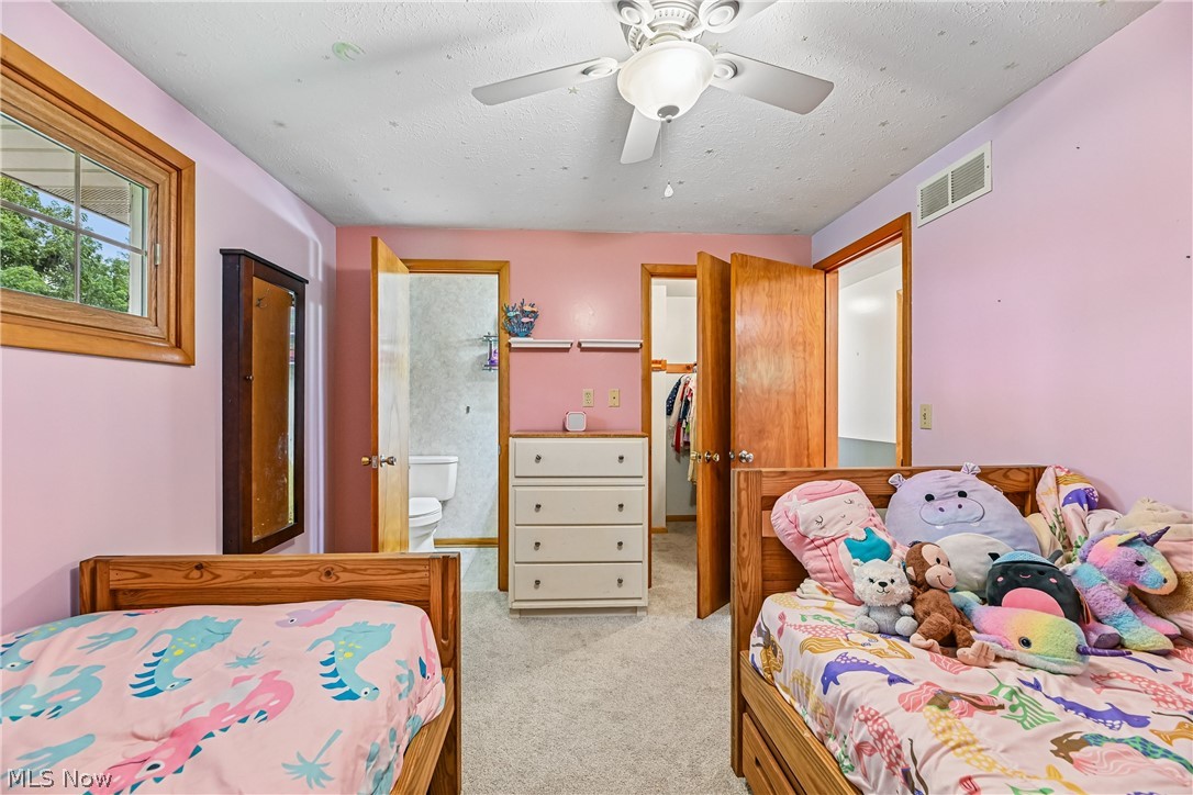 15111 Mt Eaton Road North Rittman, OH 44270 - Photo 22 of 50 Bedroom with ceiling fan / light, closet and carpet flooring