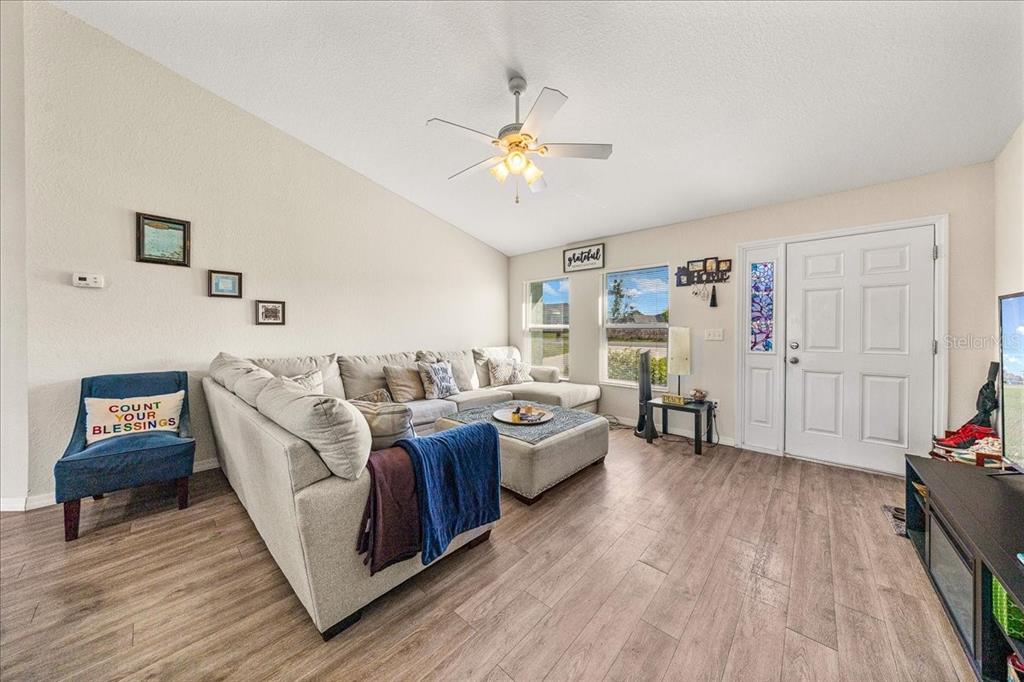 19 Juniper Loop Run Ocala, FL 34480 - Photo 11 of 42 a living room with furniture and wooden floor