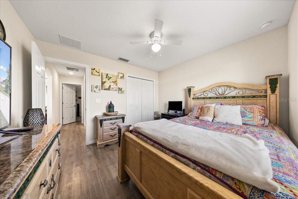 19 Juniper Loop Run Ocala, FL 34480 - Photo 15 of 42 a bedroom with a bed and a large mirror on the dresser