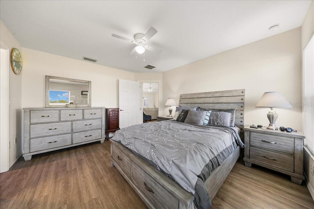 19 Juniper Loop Run Ocala, FL 34480 - Photo 21 of 42 a bedroom with a bed and a dresser