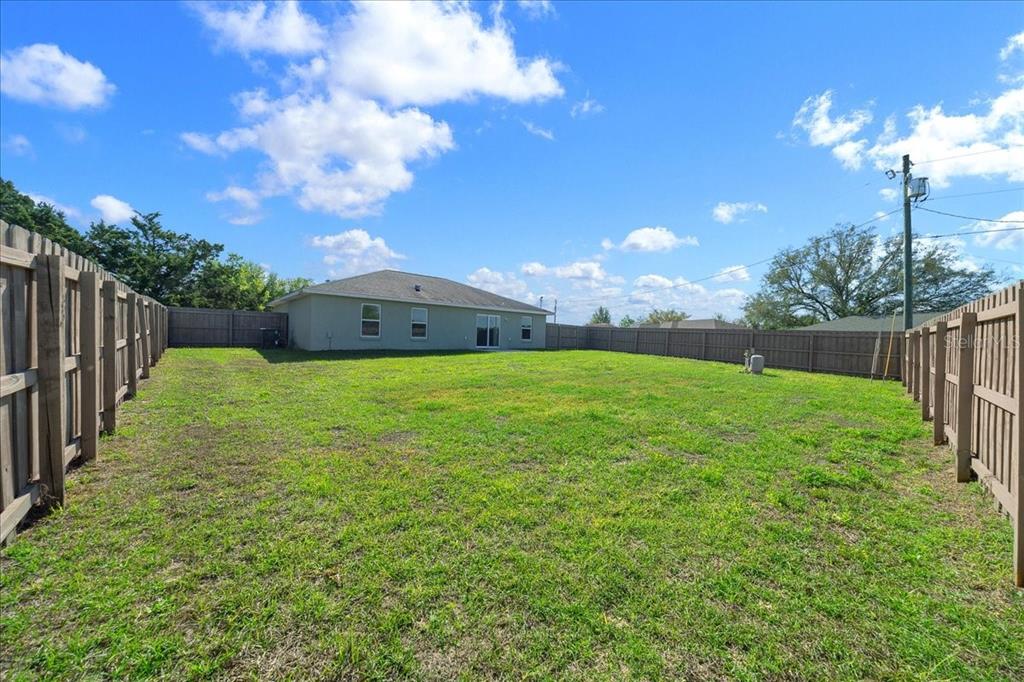19 Juniper Loop Run Ocala, FL 34480 - Photo 28 of 42 a view of a fountain in front of a house with a yard