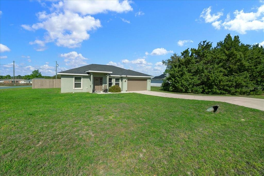 19 Juniper Loop Run Ocala, FL 34480 - Photo 29 of 42 a view of a house with a backyard