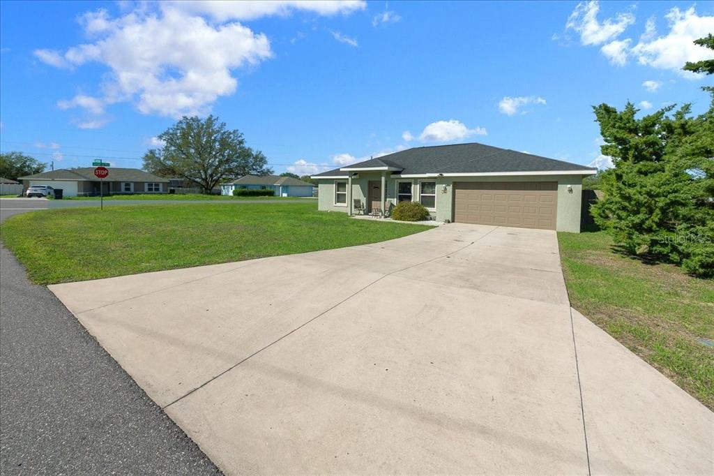 19 Juniper Loop Run Ocala, FL 34480 - Photo 31 of 42 a front view of a house with yard