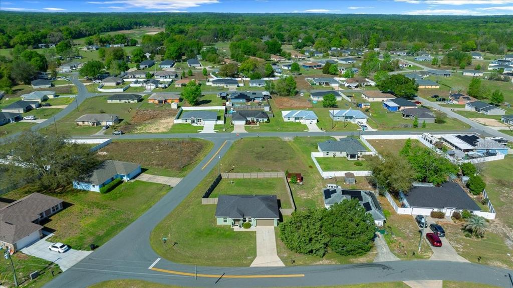 19 Juniper Loop Run Ocala, FL 34480 - Photo 36 of 42 an aerial view of residential houses with outdoor space and trees