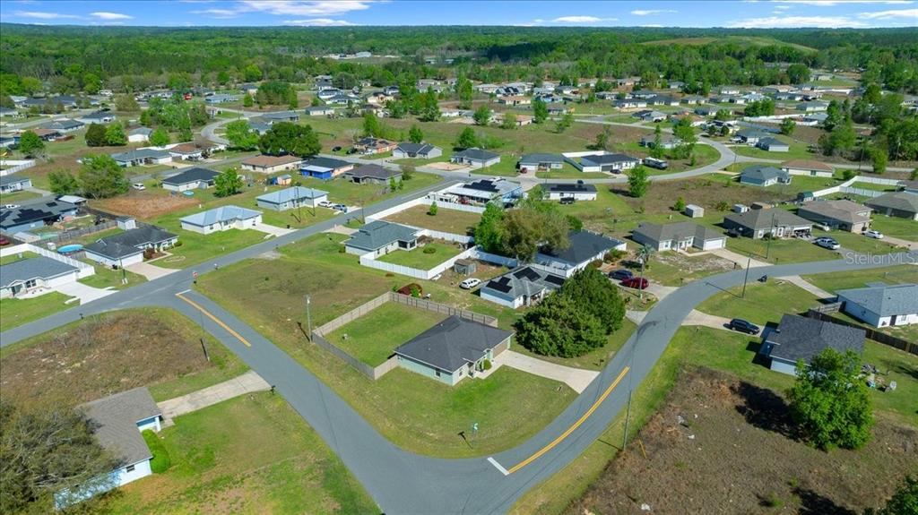19 Juniper Loop Run Ocala, FL 34480 - Photo 37 of 42 an aerial view of residential houses with outdoor space and trees