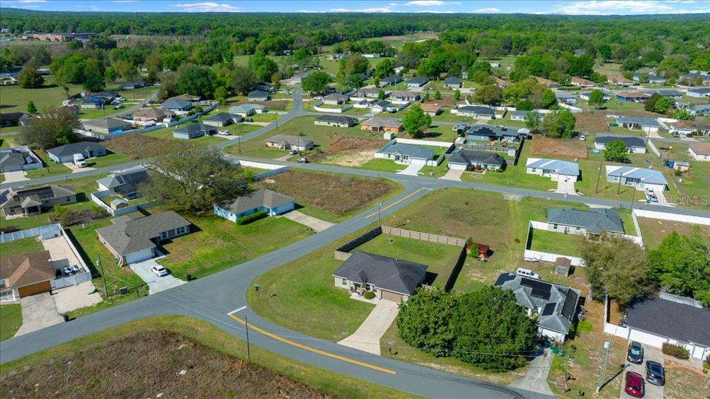 19 Juniper Loop Run Ocala, FL 34480 - Photo 38 of 42 an aerial view of residential houses with outdoor space and parking