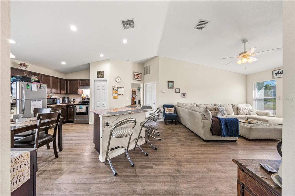 19 Juniper Loop Run Ocala, FL 34480 - Photo 4 of 42 a living room with furniture and kitchen view
