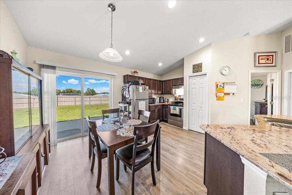 19 Juniper Loop Run Ocala, FL 34480 - Photo 5 of 42 a view of a dining room with furniture window and wooden floor