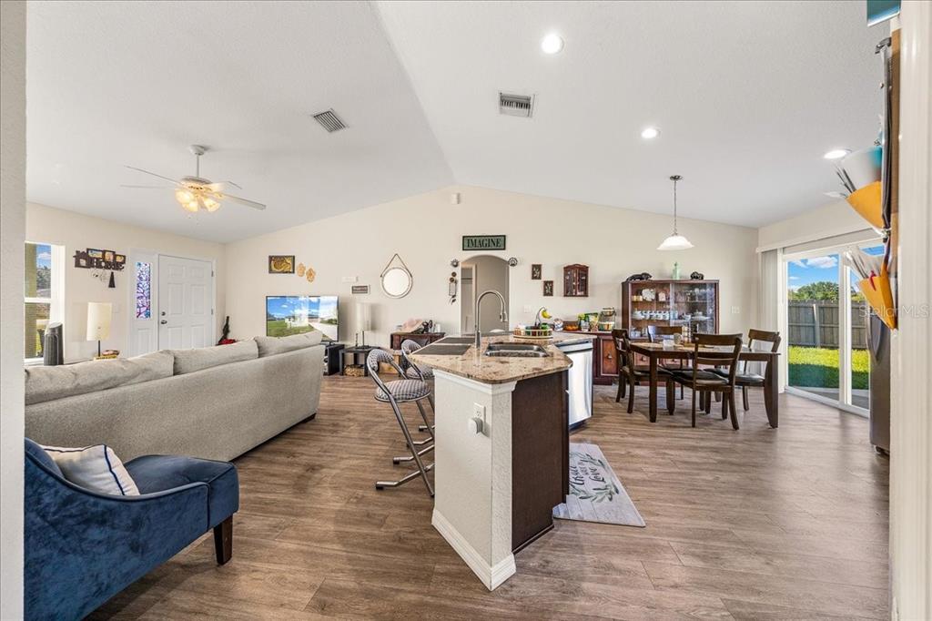 19 Juniper Loop Run Ocala, FL 34480 - Photo 6 of 42 a living room with lots of furniture and kitchen view