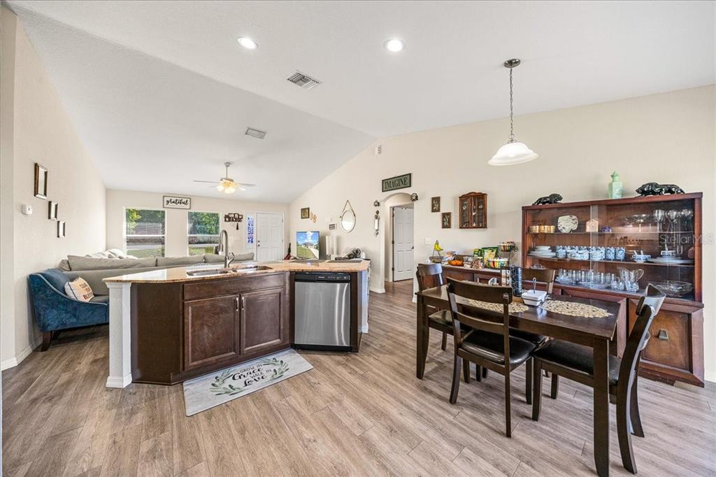 19 Juniper Loop Run Ocala, FL 34480 - Photo 8 of 42 a view of a dining room with furniture and wooden floor