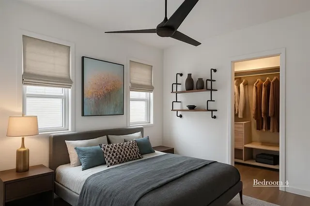 a bedroom with a bed and a lamp on table