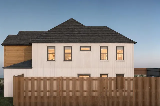 a front view of a house with a garage