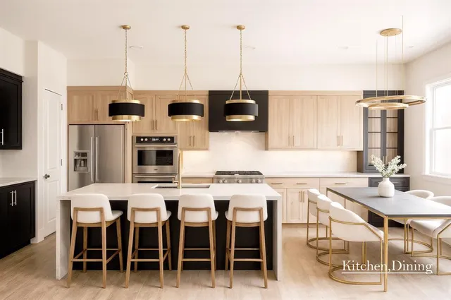 a kitchen with stainless steel appliances kitchen island granite countertop a table and chairs in it