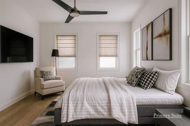 a bedroom with a bed couch and window