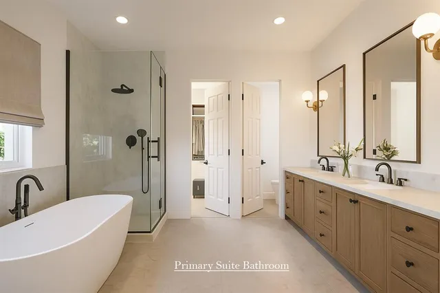 a bathroom with a double vanity sink a large mirror a bathtub and shower