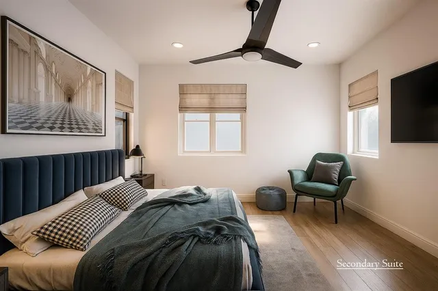 a bedroom with furniture and a window