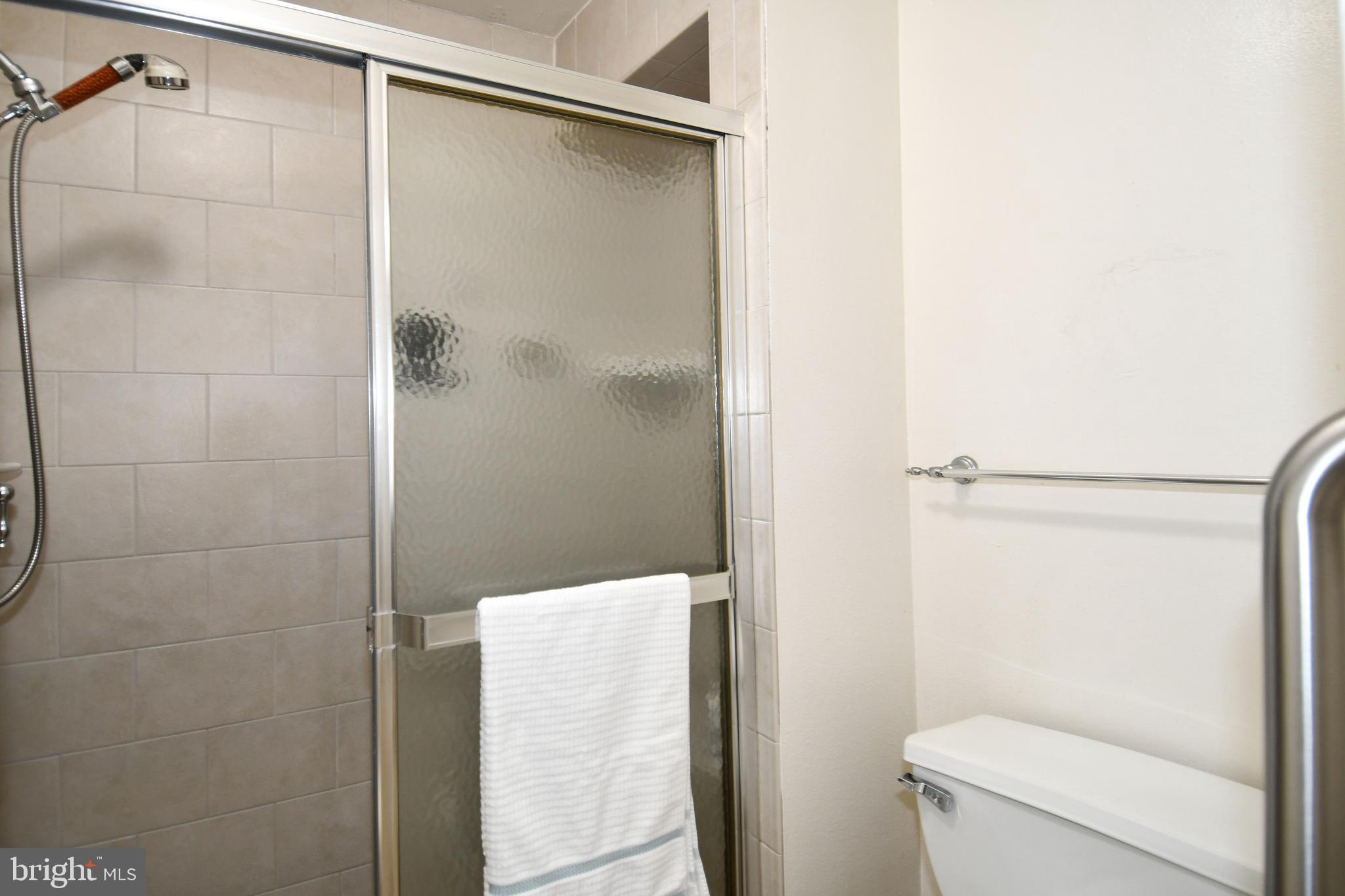 3500 Forest Edge Drive, Unit 152E Silver Spring, MD 20906 - Photo 13 of 33 a bathroom with a shower and toilet