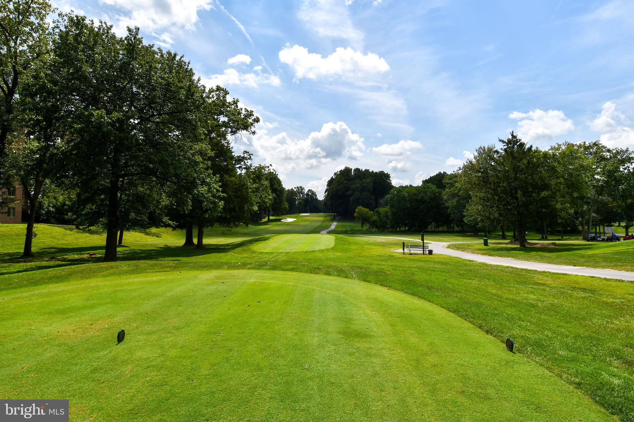 3500 Forest Edge Drive, Unit 152E Silver Spring, MD 20906 - Photo 24 of 33 a view of a golf course with a lake