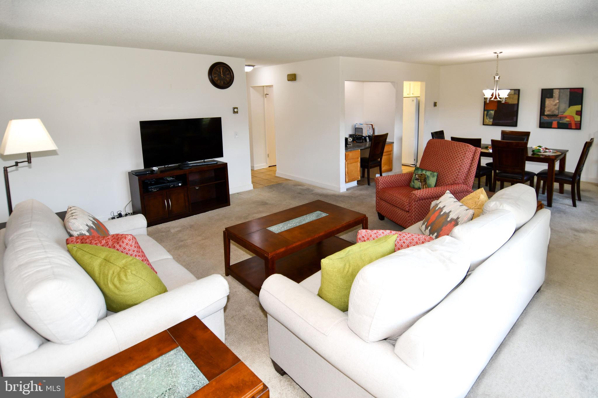 3500 Forest Edge Drive, Unit 152E Silver Spring, MD 20906 - Photo 7 of 33 a living room with furniture and a flat screen tv