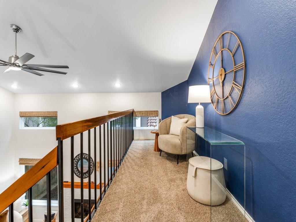 18040 Midway Road, Unit 189 Dallas, TX 75287 - Photo 11 of 28 Living area featuring carpet floors, a textured wall, ceiling fan, lofted ceiling, and an upstairs landing