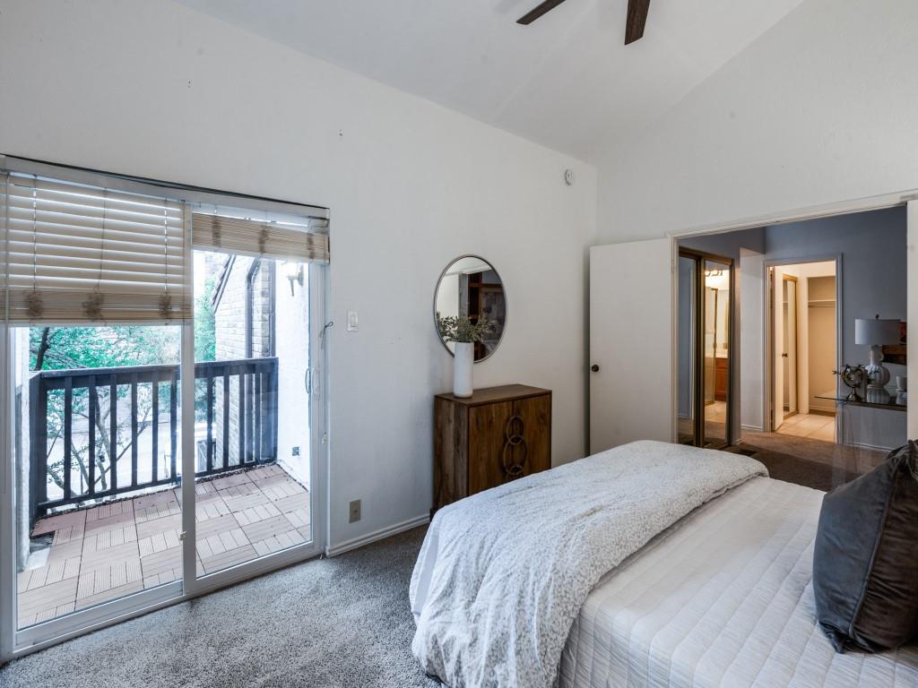 18040 Midway Road, Unit 189 Dallas, TX 75287 - Photo 16 of 28 Carpeted bedroom with vaulted ceiling, access to exterior, and ceiling fan