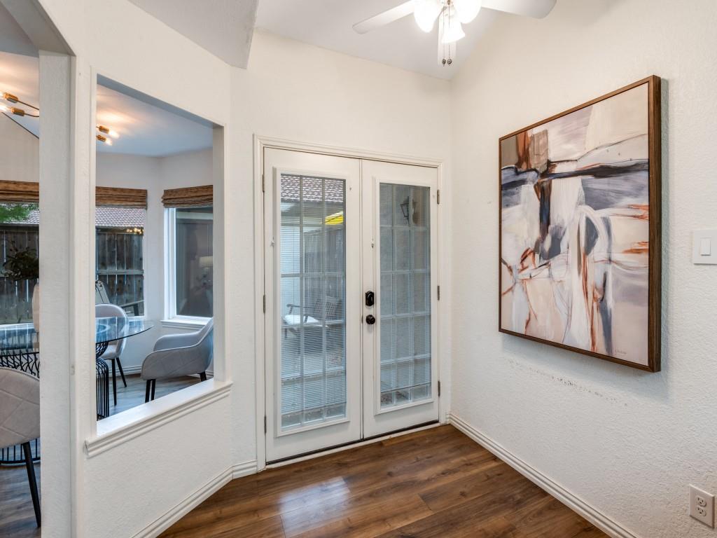 18040 Midway Road, Unit 189 Dallas, TX 75287 - Photo 5 of 28 Doorway featuring a ceiling fan, wood finished floors, a textured wall, and french doors