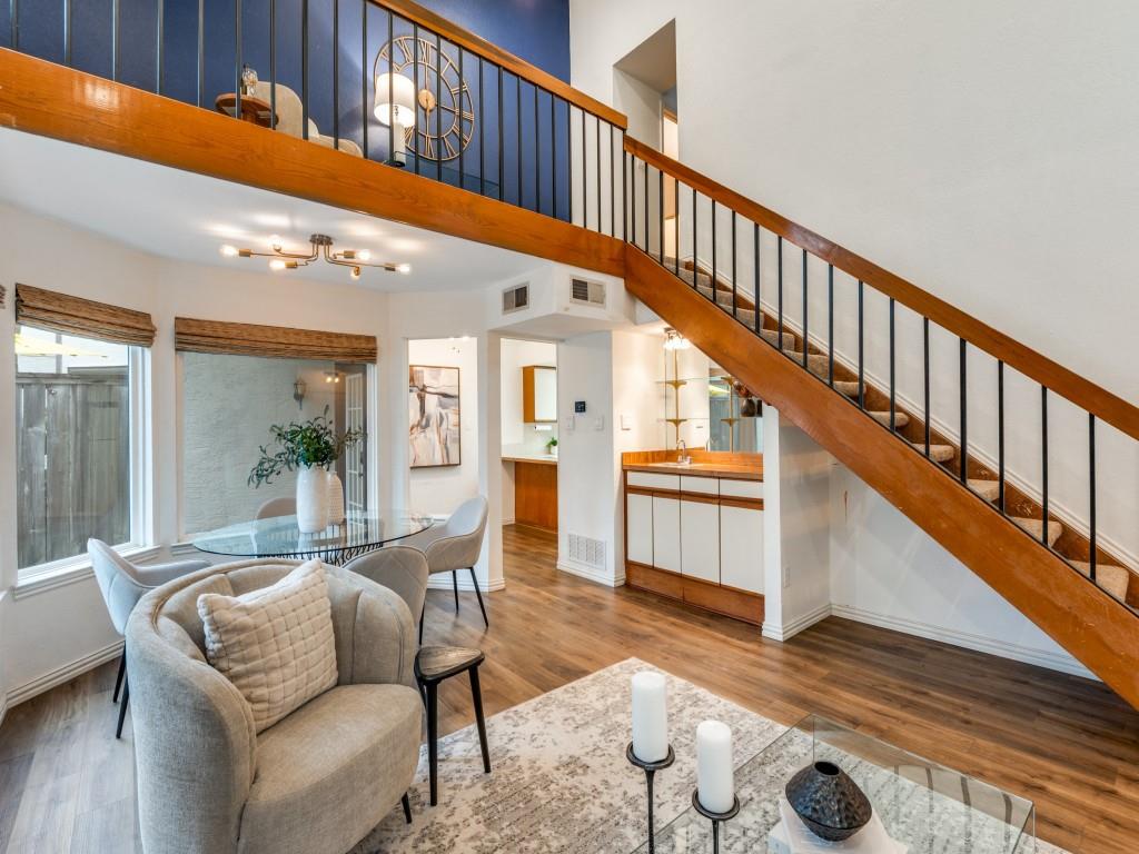 18040 Midway Road, Unit 189 Dallas, TX 75287 - Photo 6 of 28 Living area featuring stairs, wood finished floors, and a chandelier