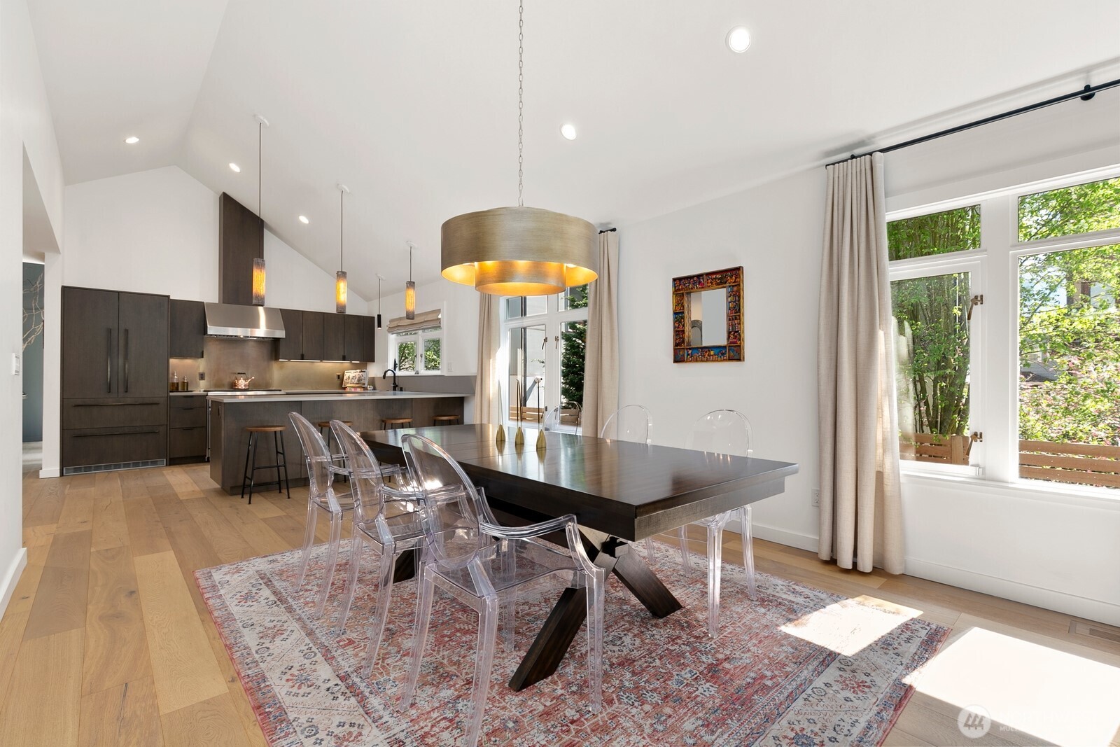 5932 California Avenue Southwest Seattle, WA 98136 - Photo 14 of 35 a room with stainless steel appliances kitchen island granite countertop dining table chairs and a large window