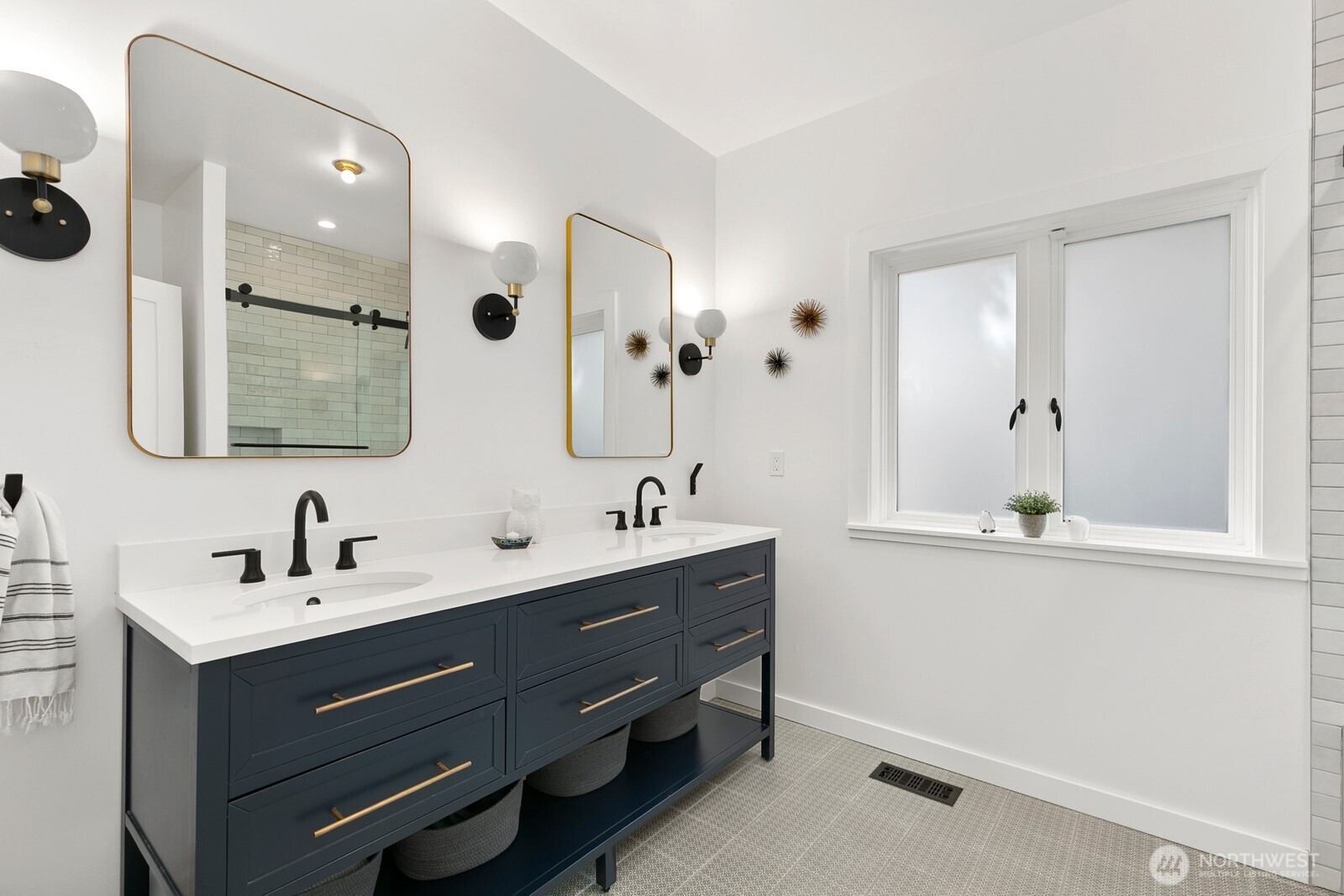 5932 California Avenue Southwest Seattle, WA 98136 - Photo 26 of 35 a bathroom with a double vanity sink a mirror and shower