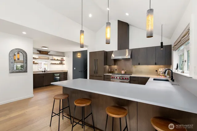 a large kitchen with a table and chairs