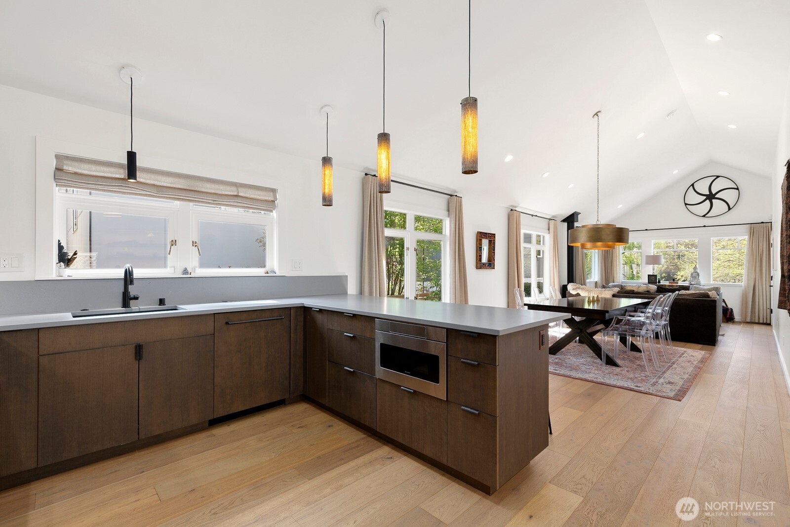 5932 California Avenue Southwest Seattle, WA 98136 - Photo 8 of 35 a kitchen with stainless steel appliances granite countertop a stove a sink and a wooden floors