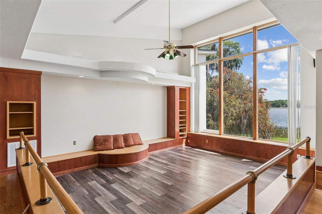 4301 Down Point Lane Windermere, FL 34786 - Photo 16 of 61 a living room with a bed furniture and a window