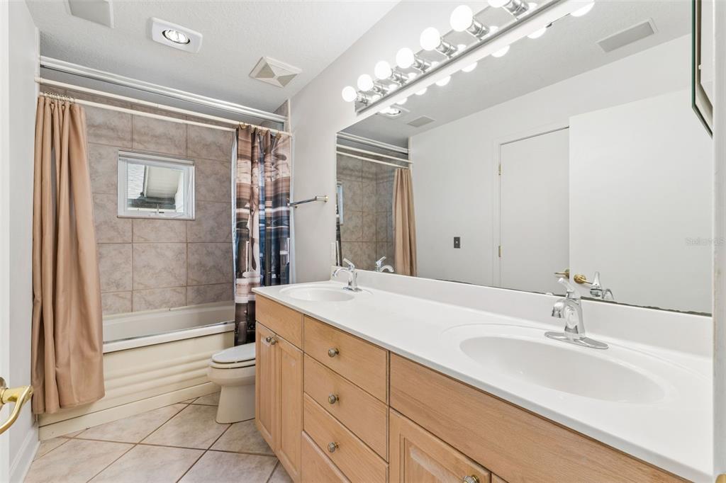 4301 Down Point Lane Windermere, FL 34786 - Photo 28 of 61 a bathroom with a sink a toilet and shower