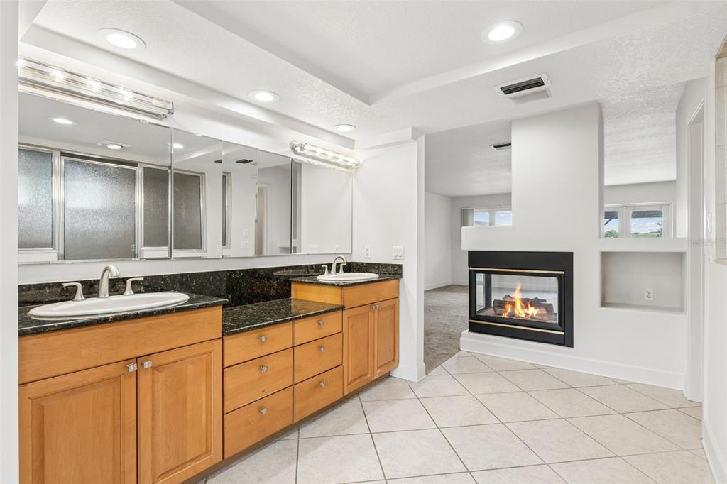 4301 Down Point Lane Windermere, FL 34786 - Photo 37 of 61 a kitchen with granite countertop a stove sink and cabinets