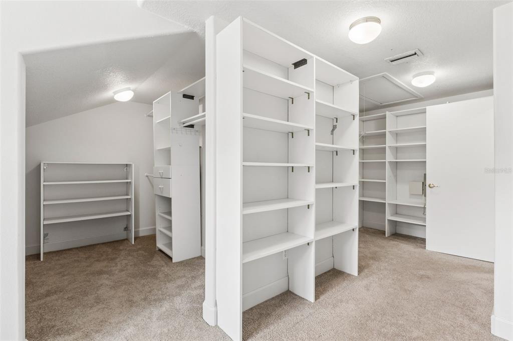 4301 Down Point Lane Windermere, FL 34786 - Photo 39 of 61 a view of walk in closet with empty racks