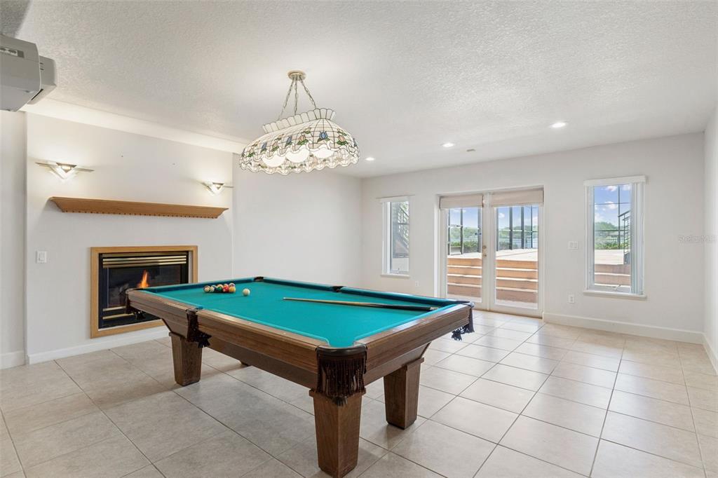 4301 Down Point Lane Windermere, FL 34786 - Photo 42 of 61 a room with pool table and windows