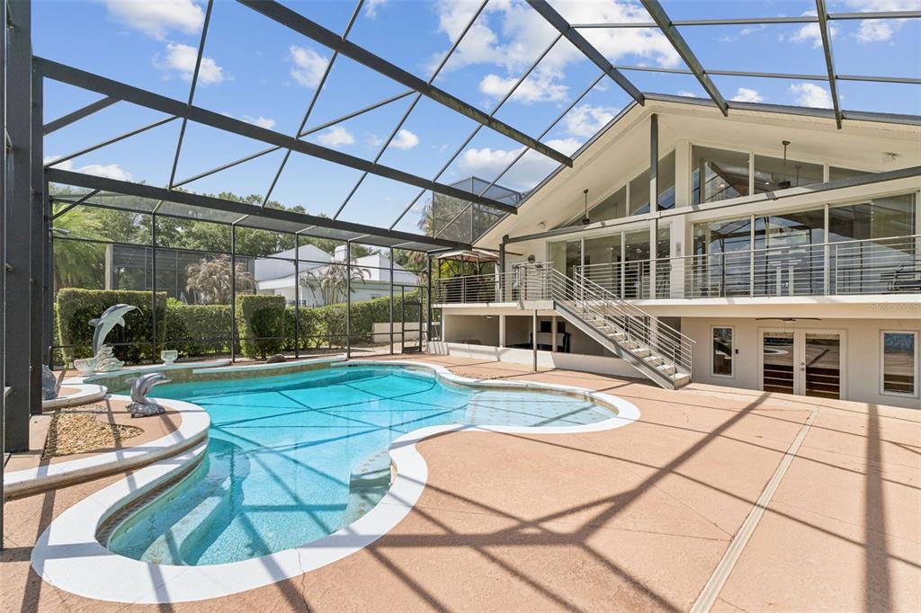 4301 Down Point Lane Windermere, FL 34786 - Photo 49 of 61 a view of a swimming pool with a patio