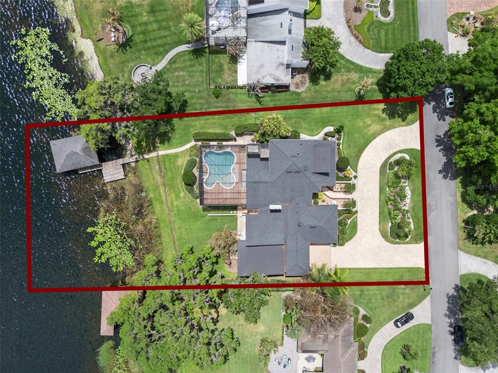 4301 Down Point Lane Windermere, FL 34786 - Photo 60 of 61 an aerial view of a house with a garden and lake view