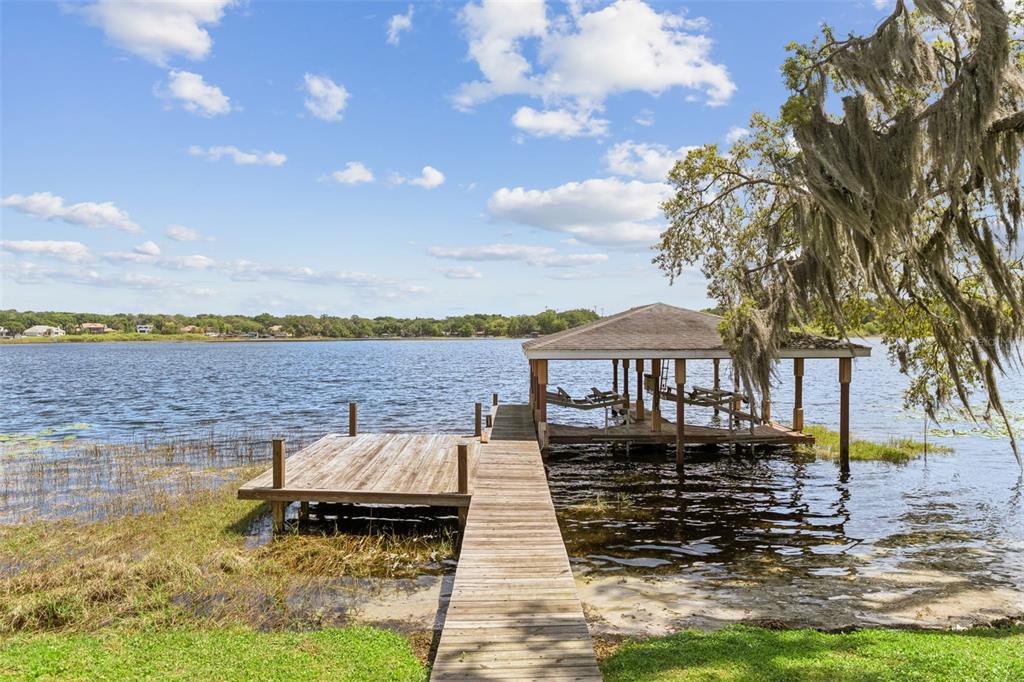 4301 Down Point Lane Windermere, FL 34786 - Photo 7 of 61 a view of a lake with couches and city view