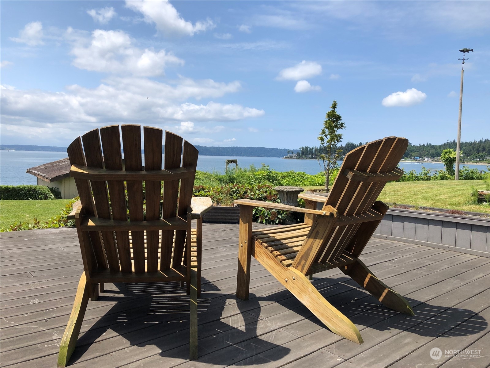 6918 Totem Beach Loop Road Marysville, WA 98271 - Photo 1 of 29 a view of balcony with wooden floor and outdoor seating