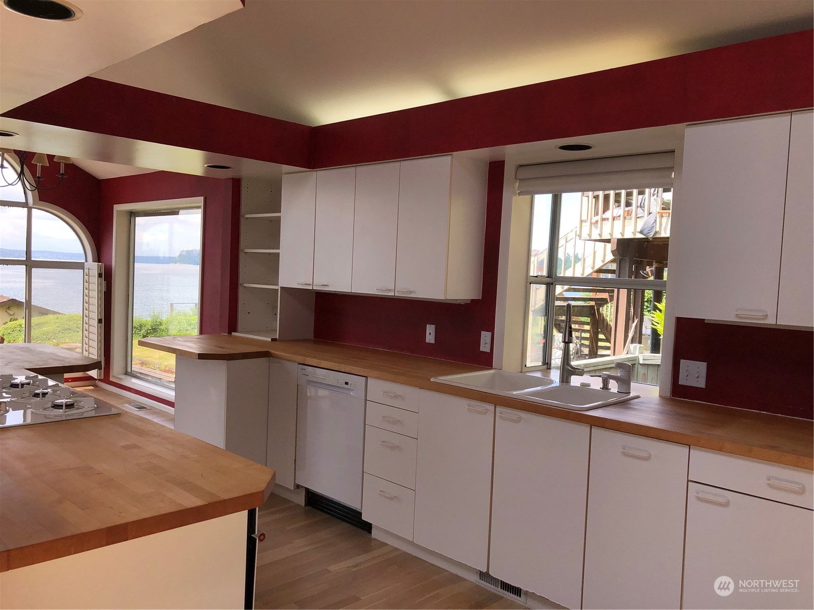 6918 Totem Beach Loop Road Marysville, WA 98271 - Photo 14 of 29 a kitchen with a sink and large window