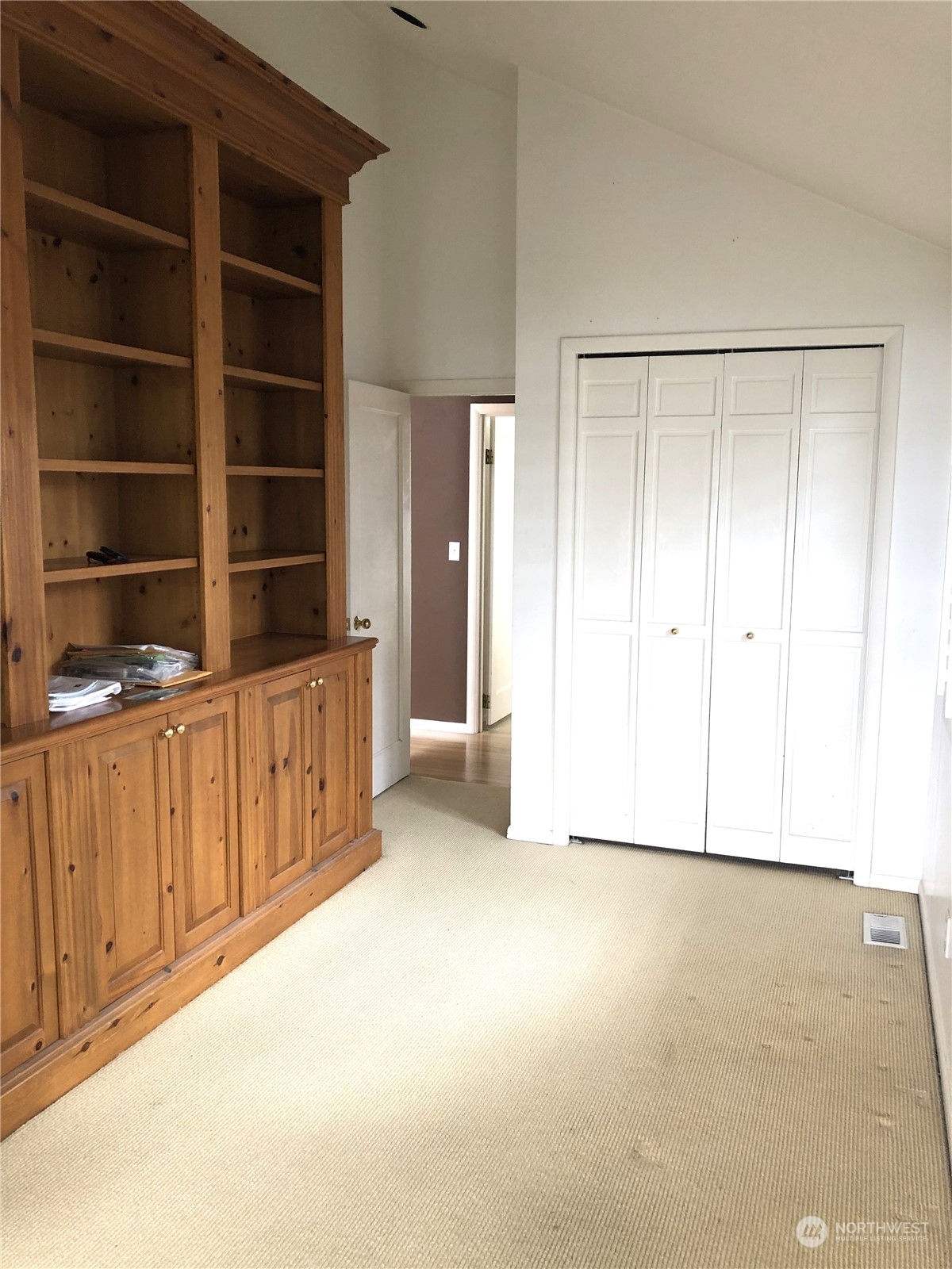 6918 Totem Beach Loop Road Marysville, WA 98271 - Photo 18 of 29 a view of an empty room with a wooden cabinet