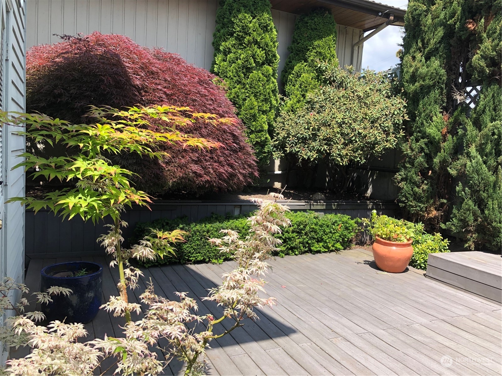 6918 Totem Beach Loop Road Marysville, WA 98271 - Photo 29 of 29 a view of a backyard with plants and a garden