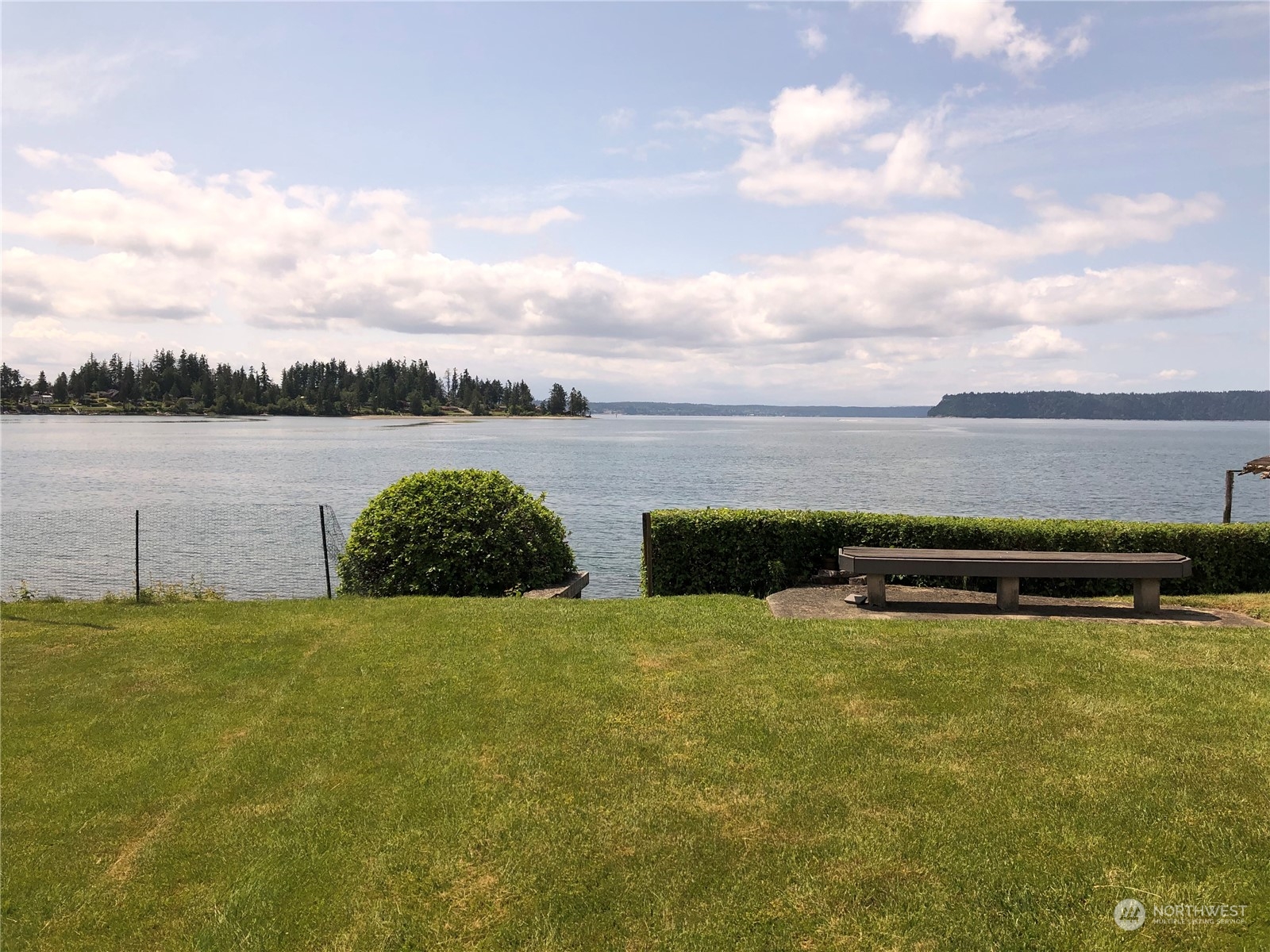 6918 Totem Beach Loop Road Marysville, WA 98271 - Photo 6 of 29 a view of an ocean beach and a mountain