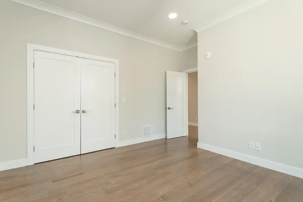 an empty room with wooden floor