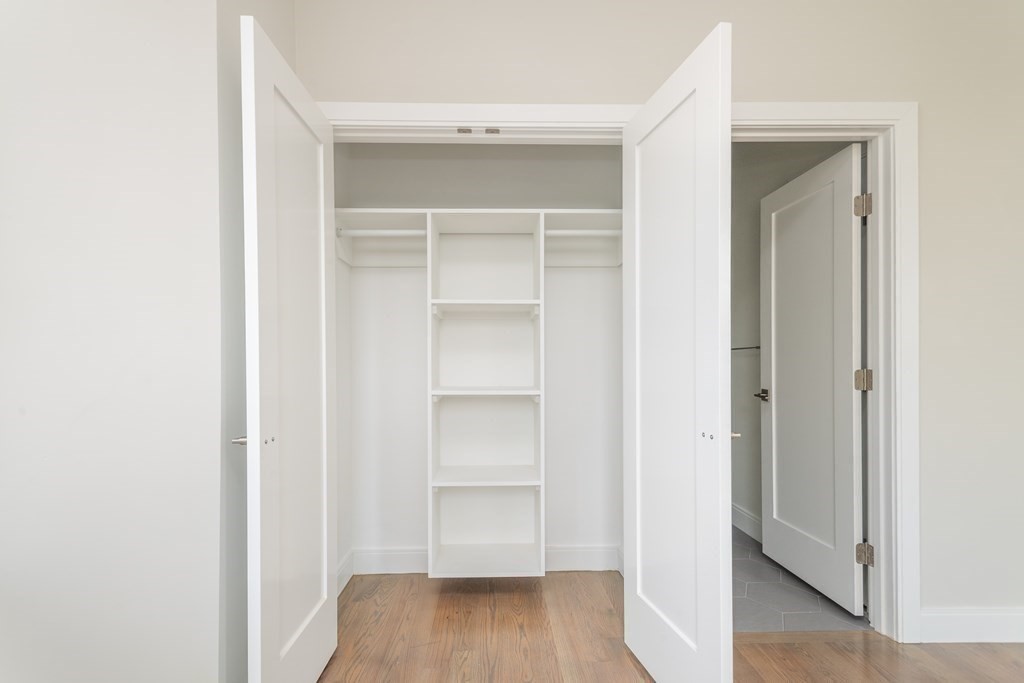 3247 Washington Street, Unit 3 Boston, MA 02130 - Photo 13 of 15 a view of walk in closet with wooden floor