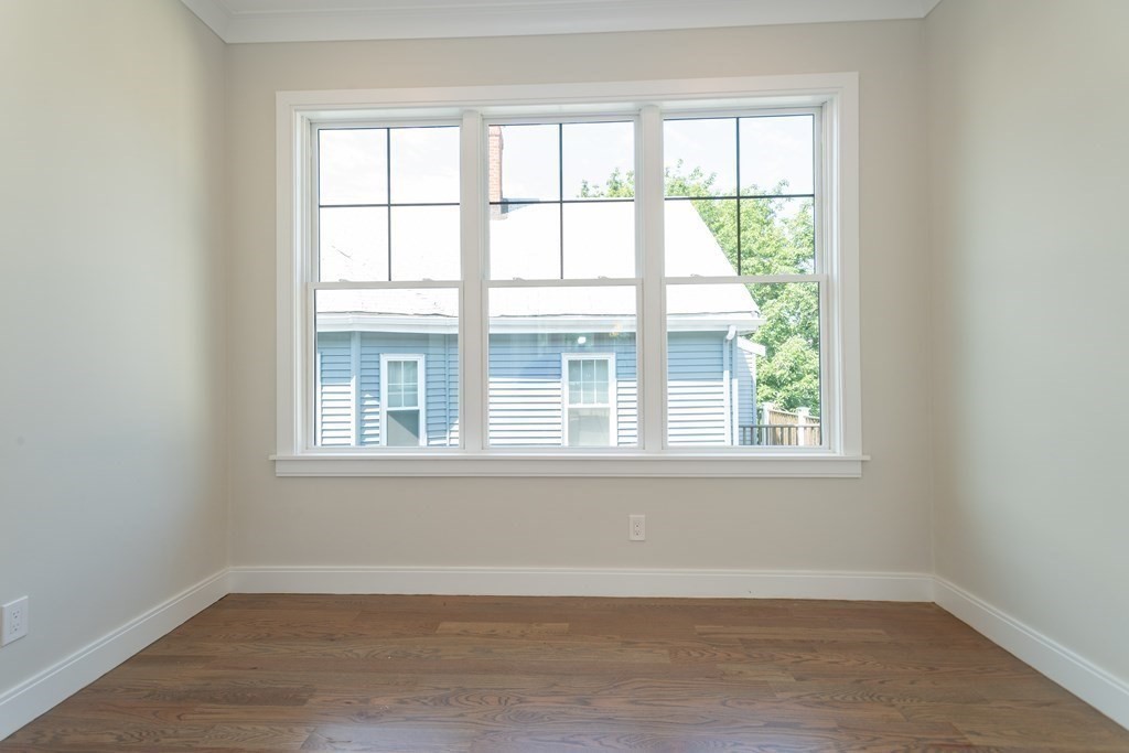 3247 Washington Street, Unit 3 Boston, MA 02130 - Photo 2 of 15 an empty room with a window